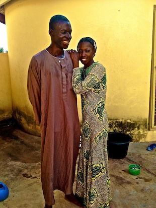 Langa Amadu with his wife Adiga Sulemana, outside their home in Dr. Abdulai's clinic