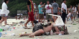 A post-party scene on the beaches of Thailand, one of the detriments of global tourism.