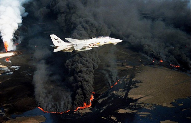 The Kuwaiti oil fires were not just limited to burning oil wells, one of which is seen here in the background, but burning "oil lakes", by USDefenseImagery