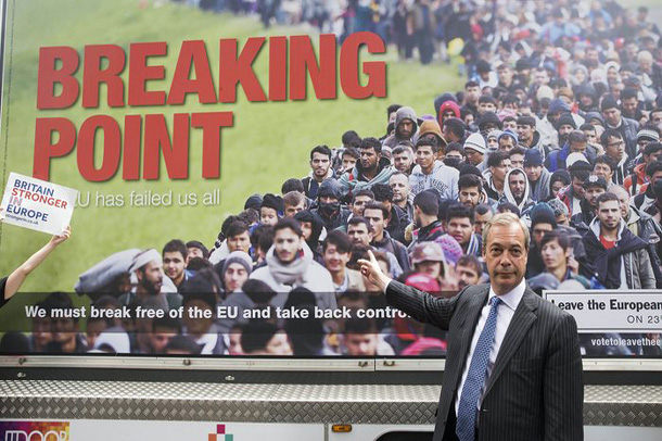 Nigel Farage, prominent British right-wing politician poses next to controversial Brexit poster | The Guardian